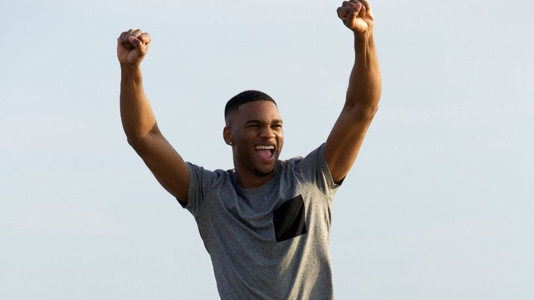 Energetic man running with arms raised – GeneIII L-Ergothioneine supplement for vitality and recovery