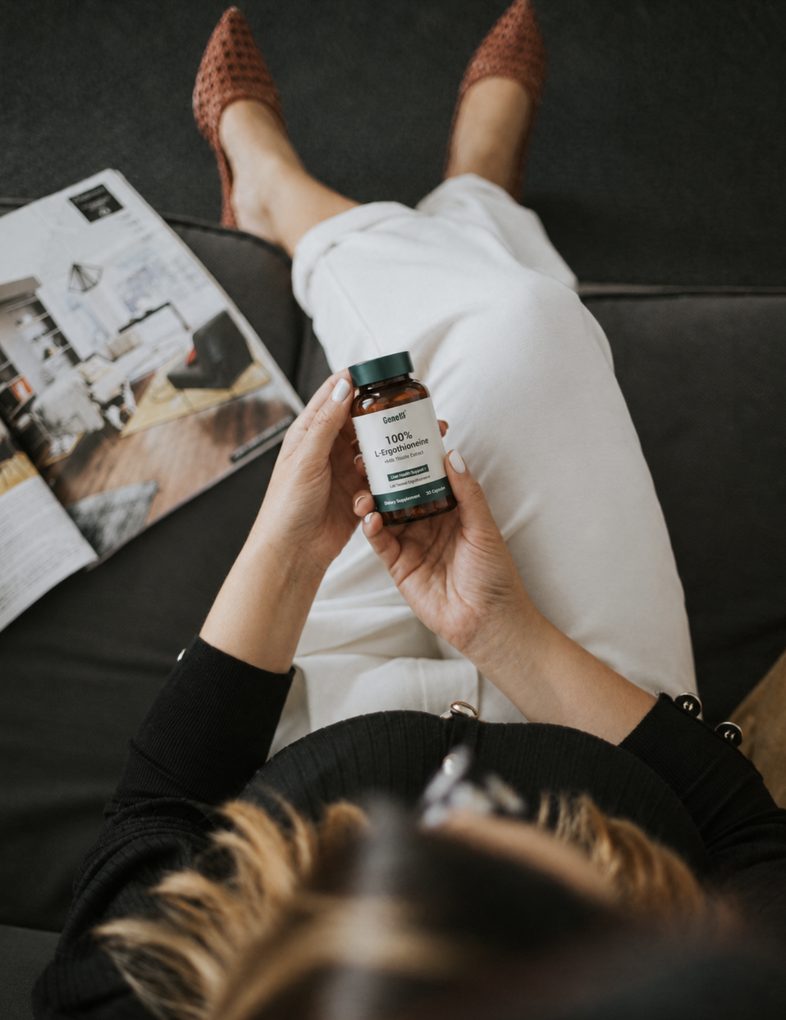 GeneIII EGT + Milk Thistle Extract bottle held in hand