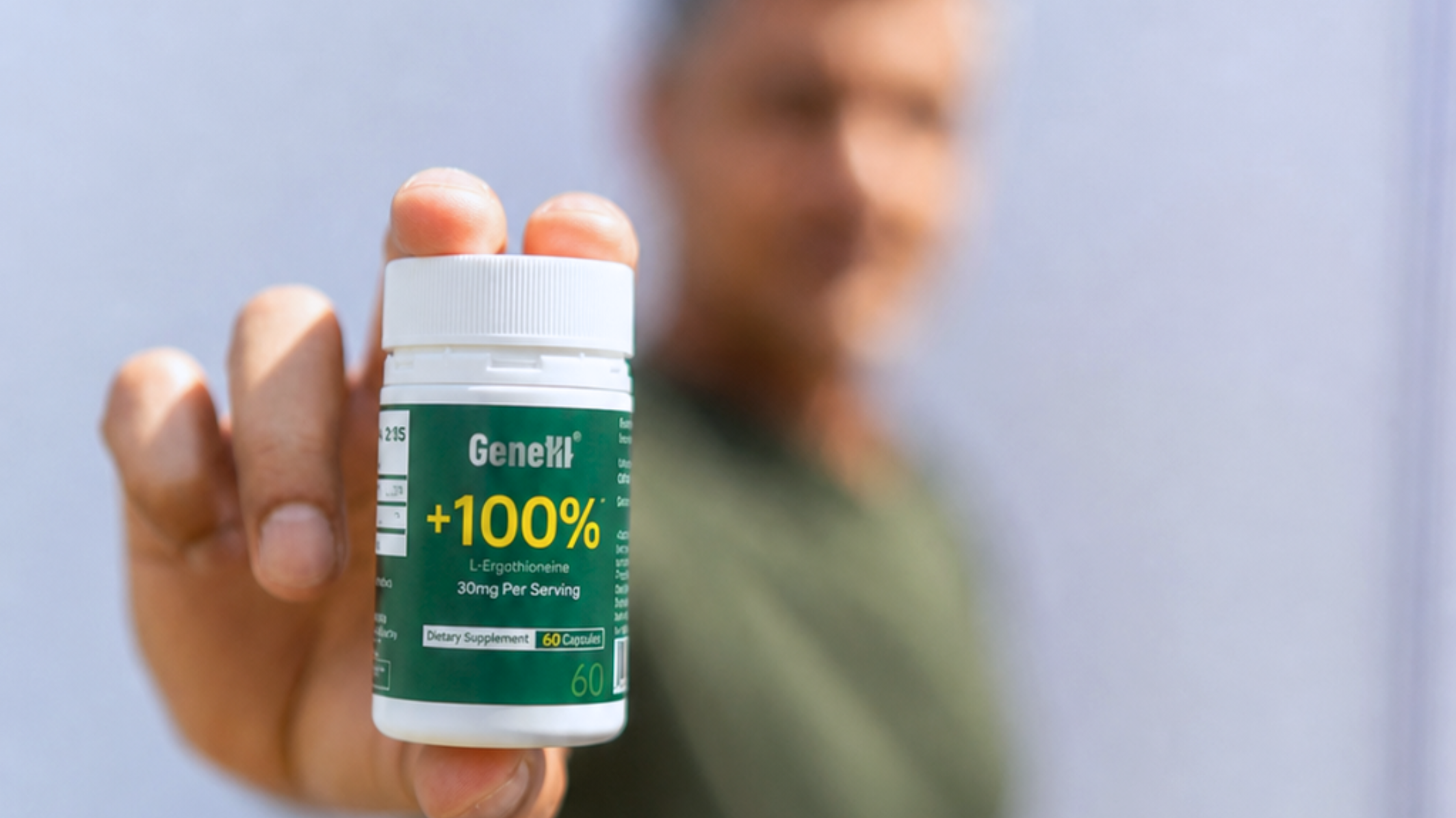 Man holding GeneIII L-Ergothioneine 30mg bottle, illustrating daily supplement routine
