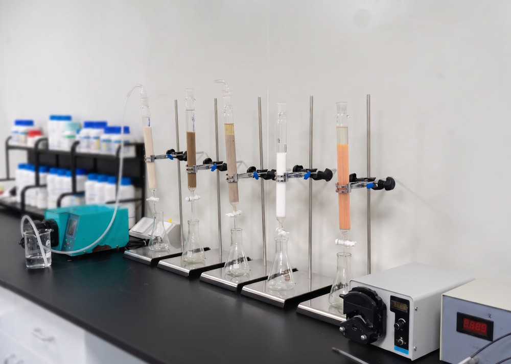 Quality-control testing equipment with rows of test tubes in a laboratory