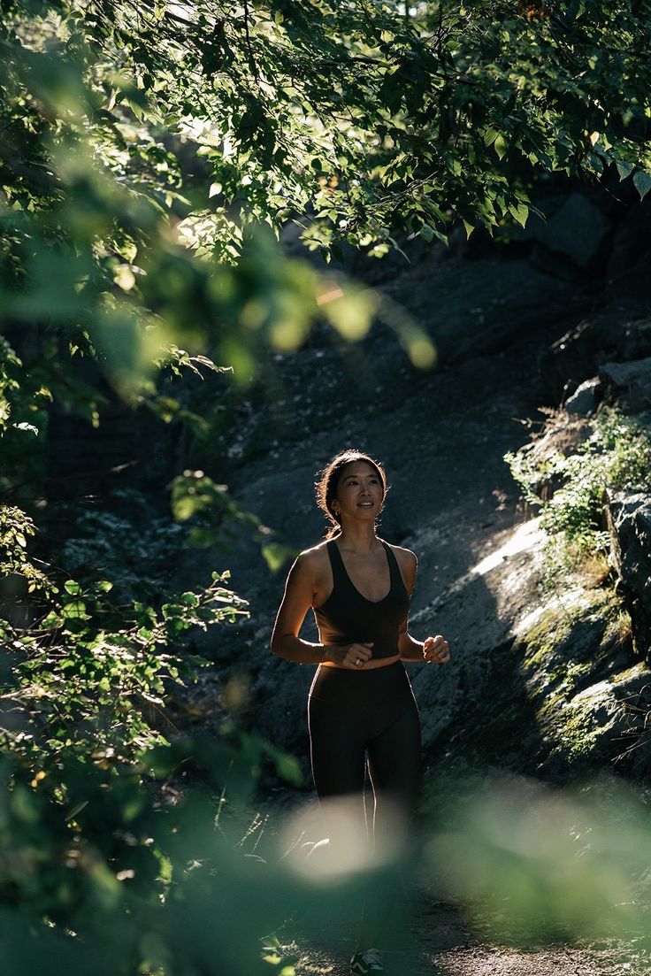 Woman running on a forest trail