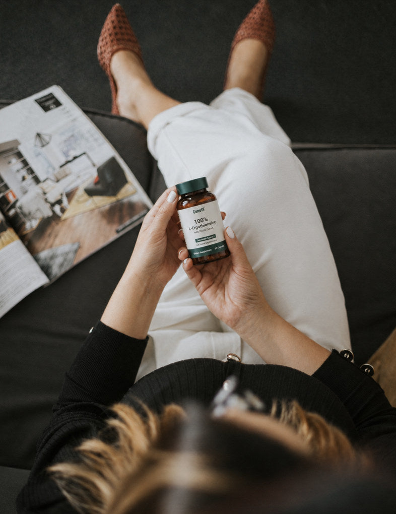 GeneIII EGT + Milk Thistle Extract bottle held in hand